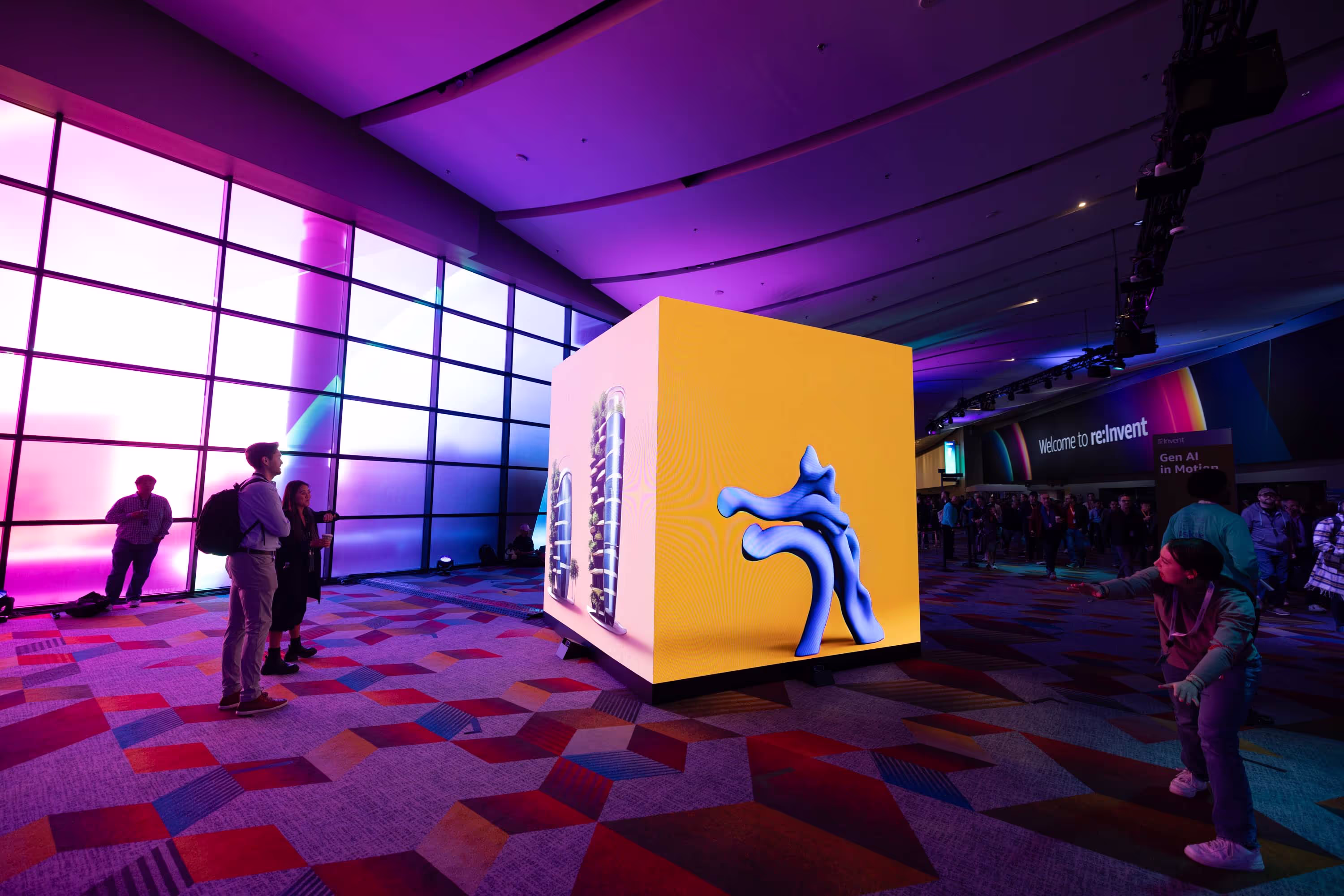 A group of people standing around a yellow box