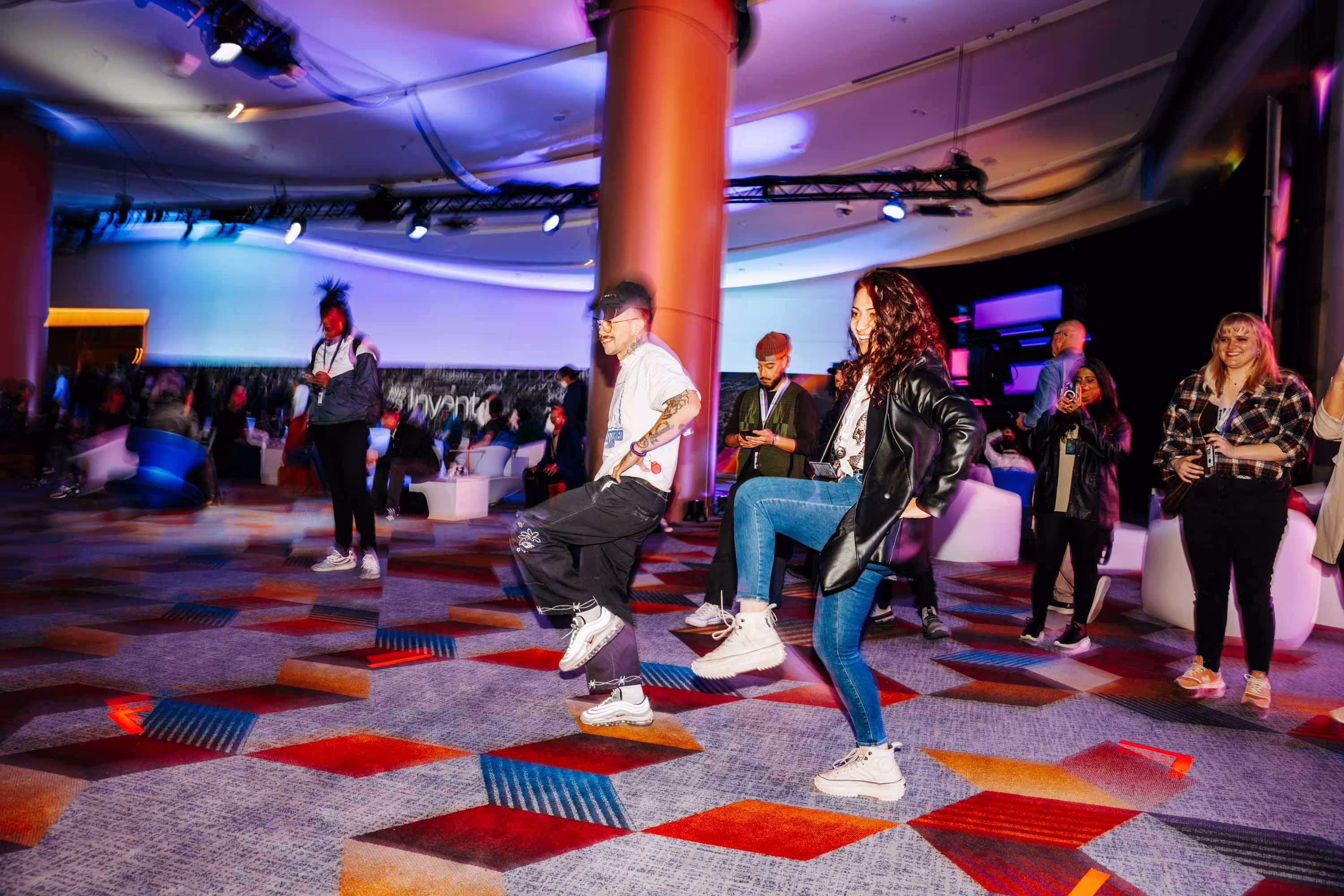 A group of people dancing in a room