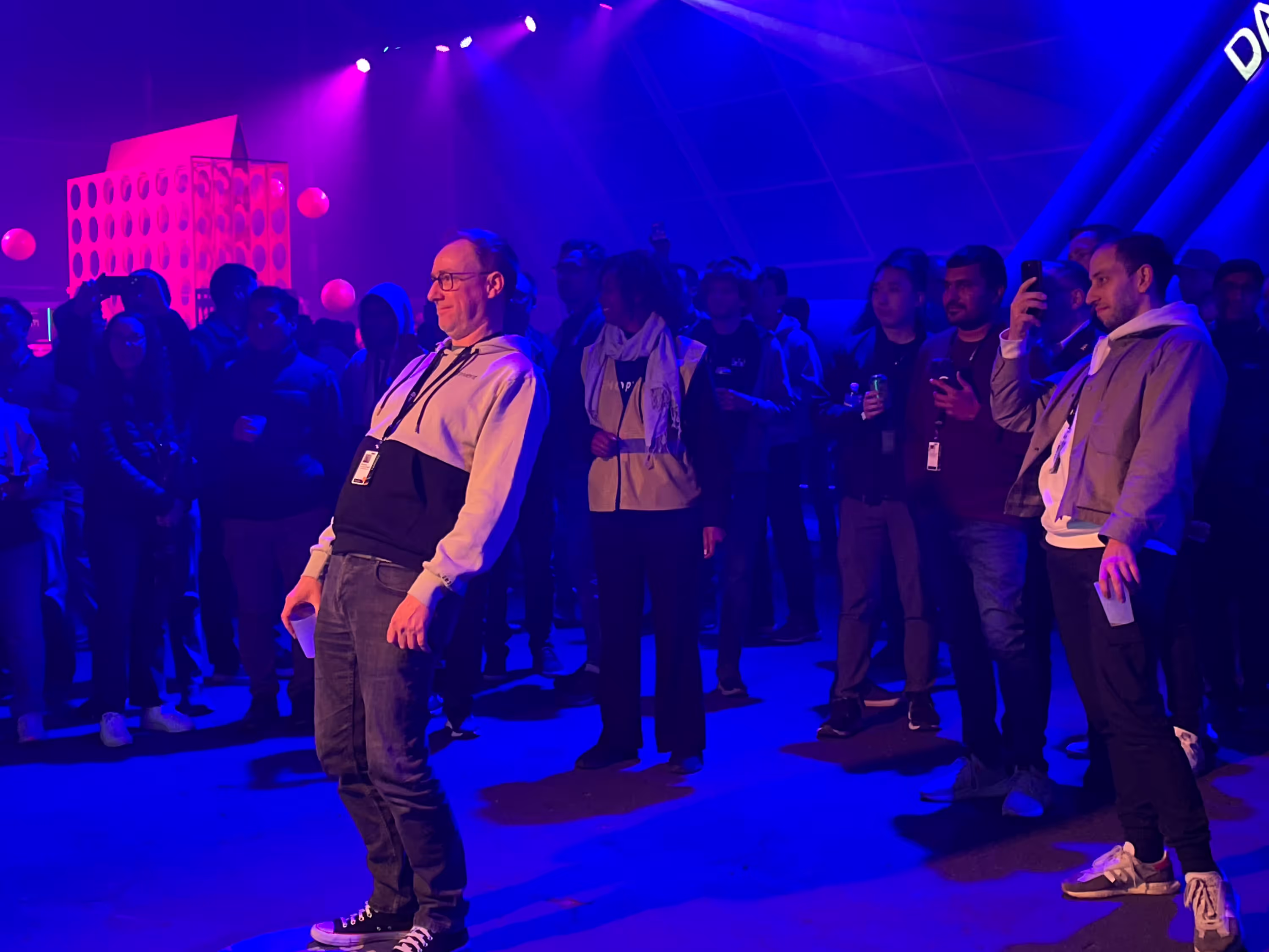 People standing in front of a crowd