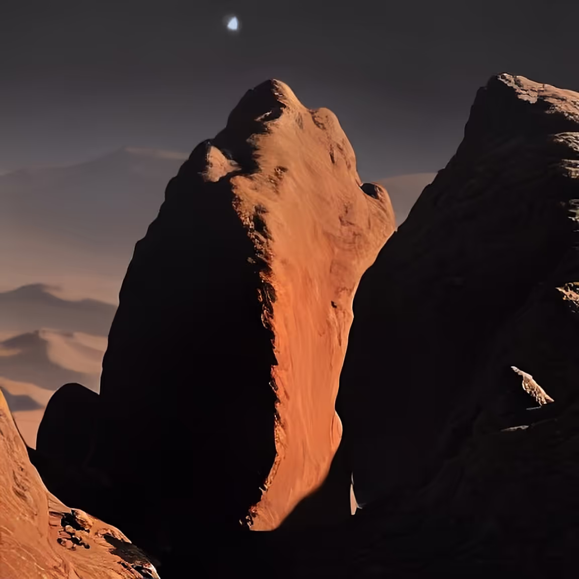 A rock formation in the desert with a moon in the background