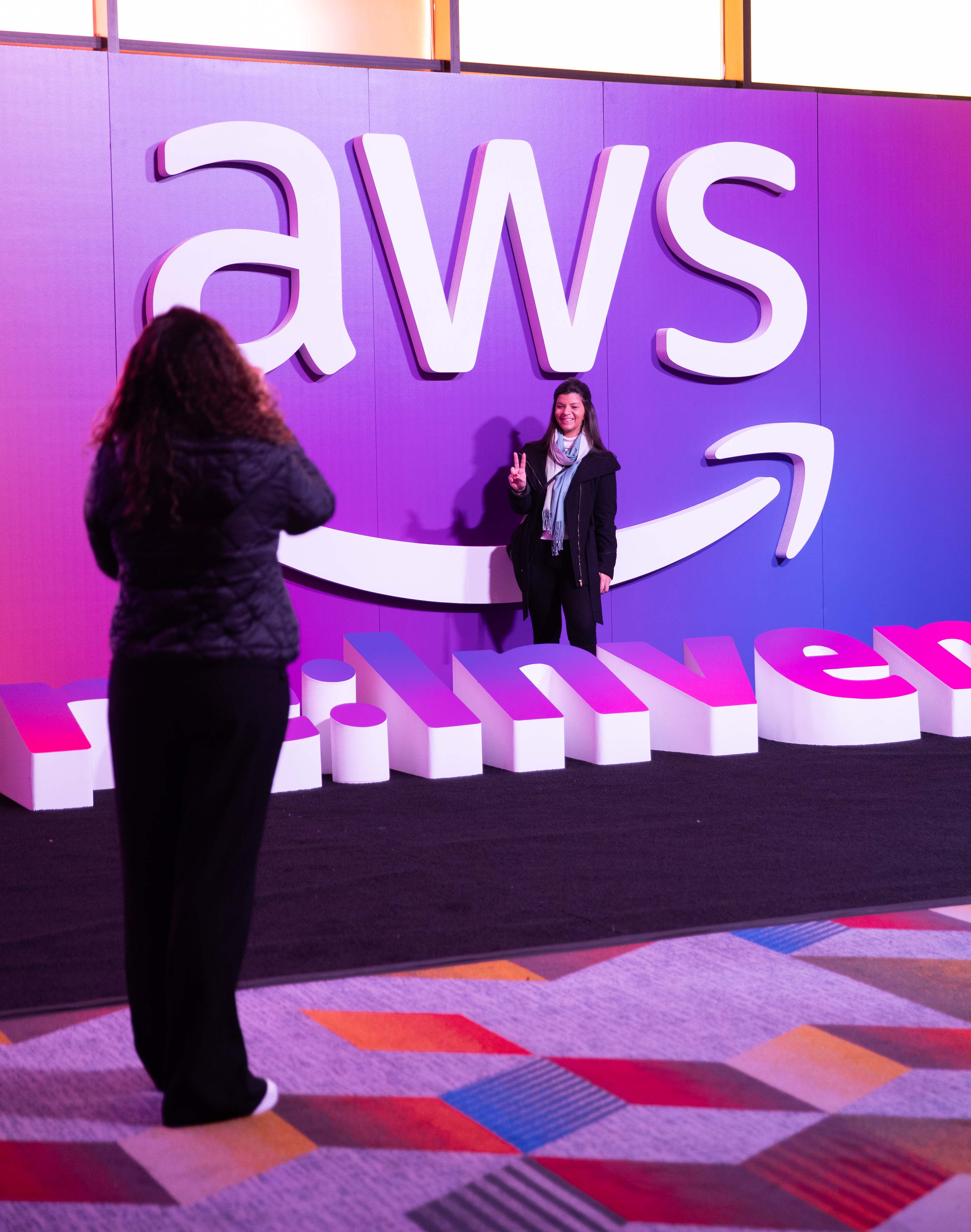 aws logo on purple wall