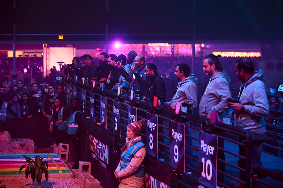 Guests at the RC Racers barrier behind the numbered player stations