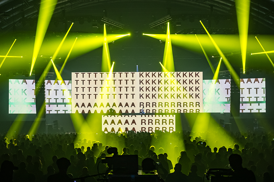 A group of people standing on top of a stage.