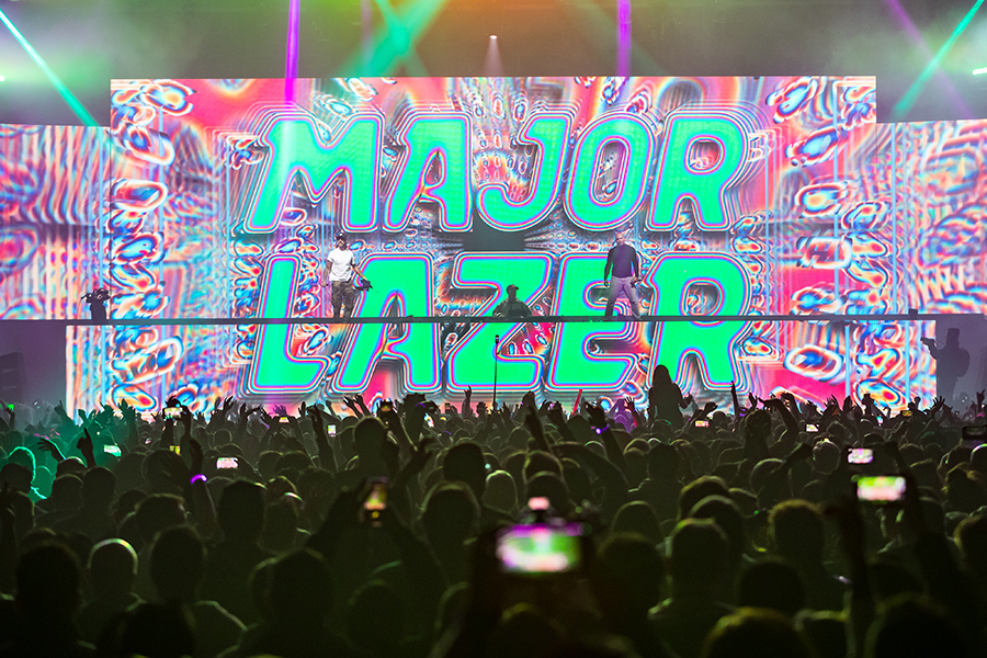 A large group of people standing on top of a stage.