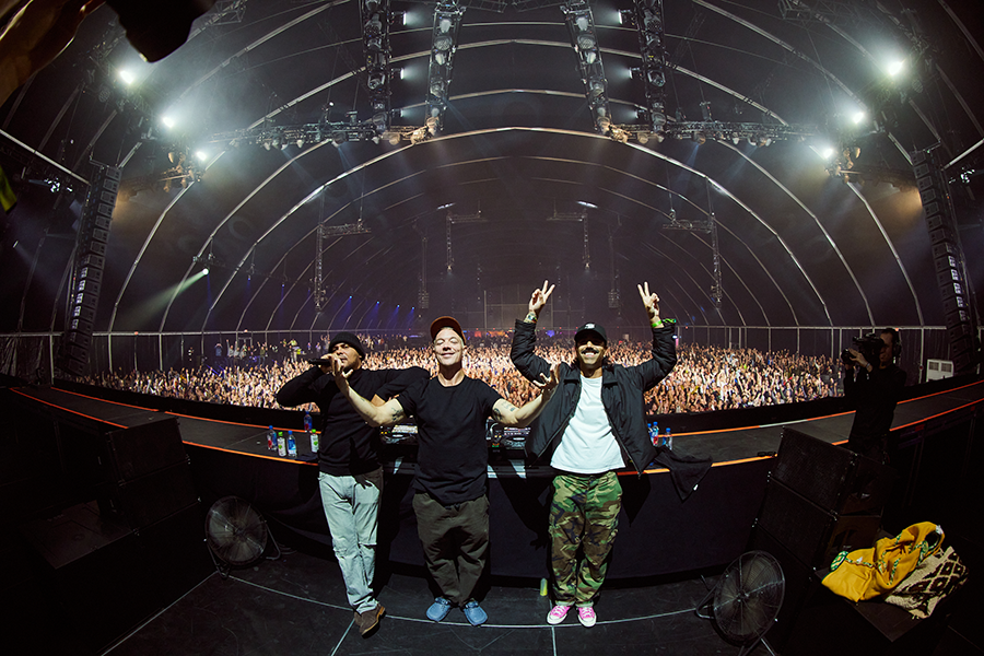 A group of men standing on top of a stage.