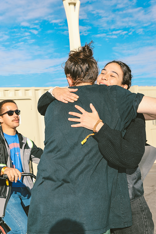 A couple of people that are hugging each other.