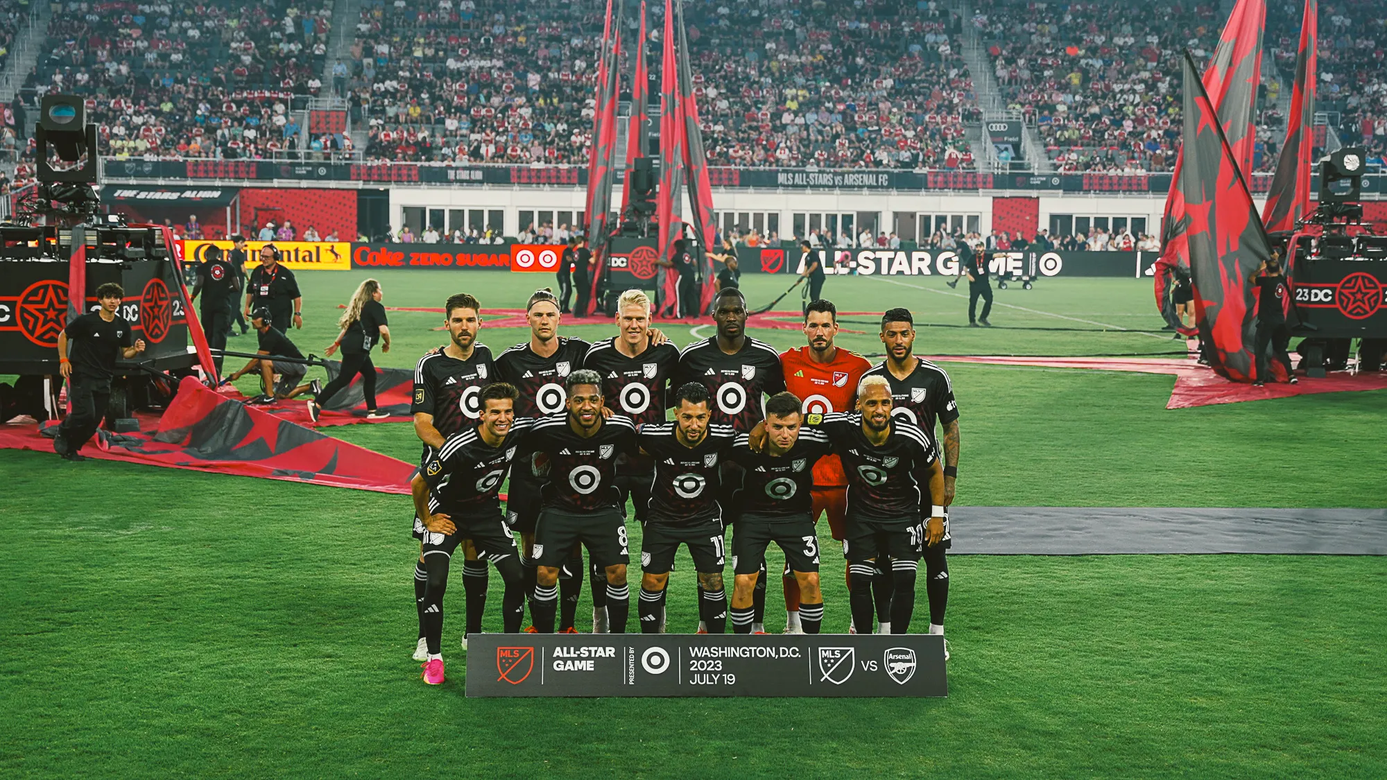 soccer players standing on a field