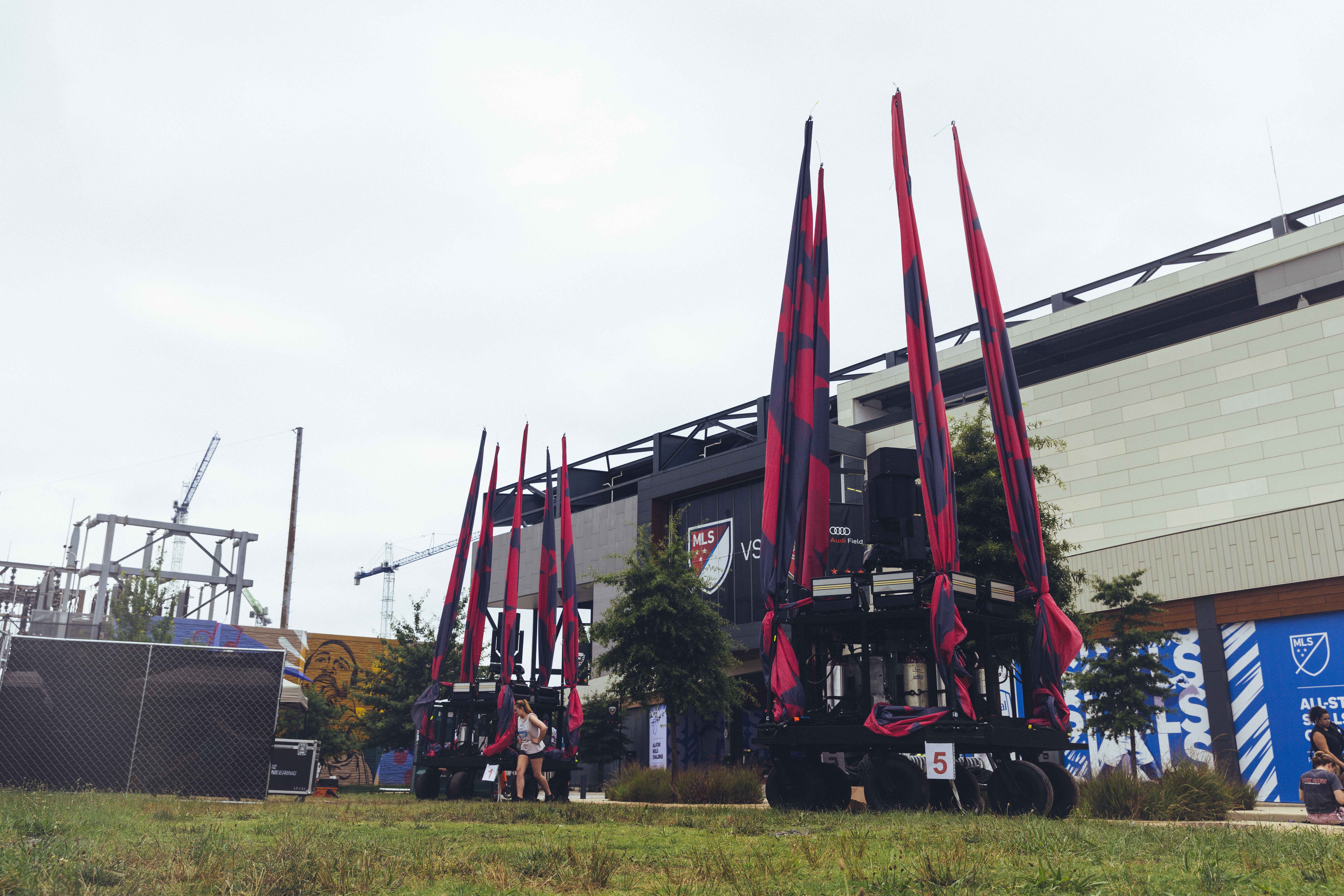 black and red flags outside on poles folded up