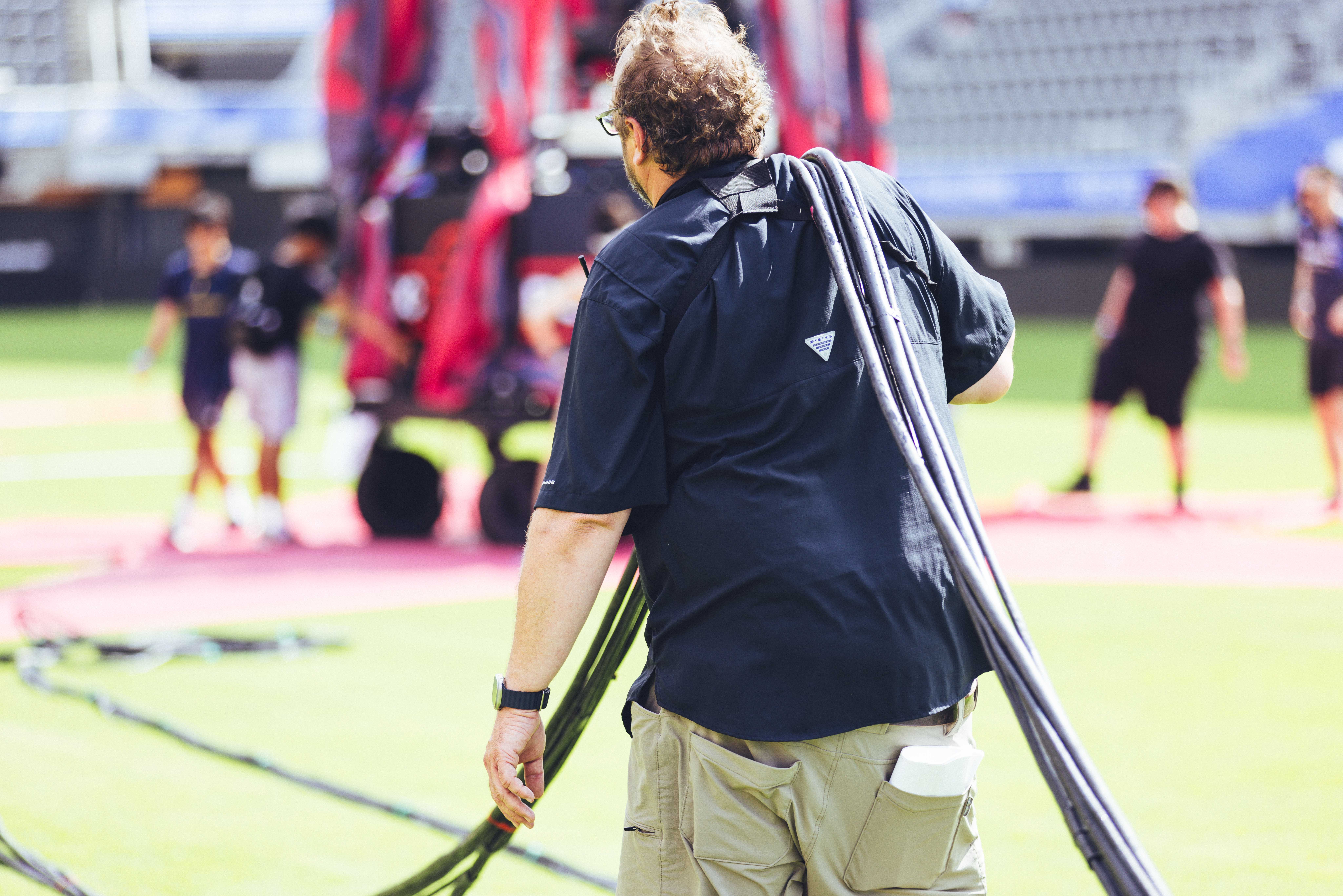 man walking on soccer field before the game