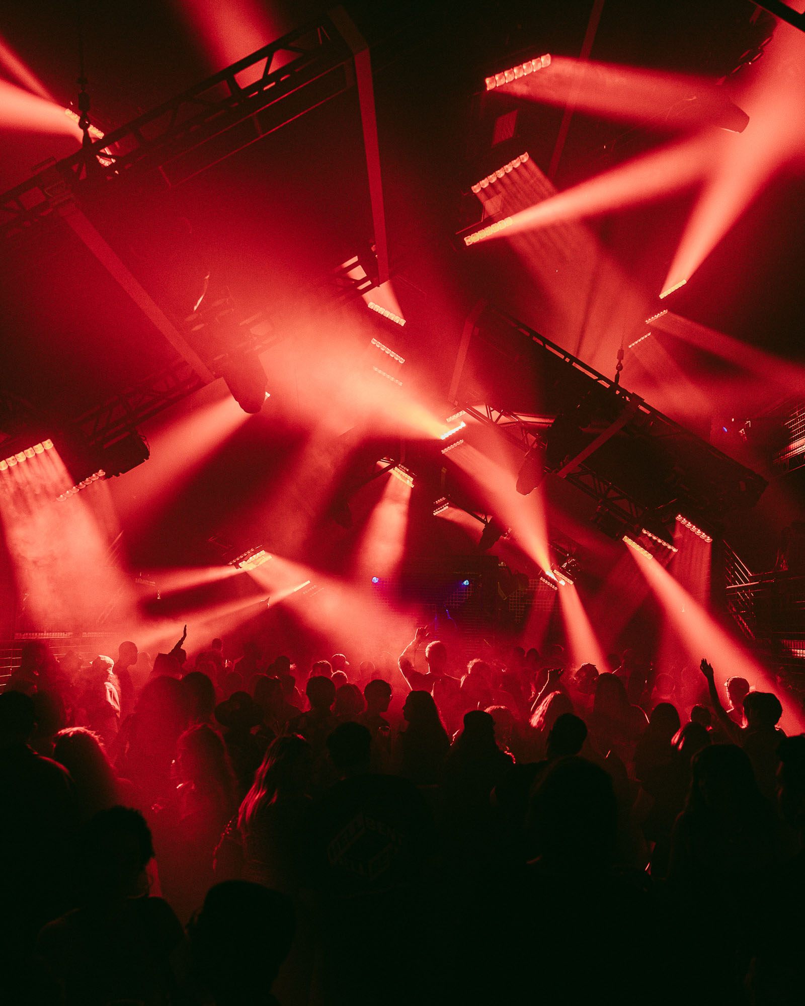 Crowd at rave with red lights