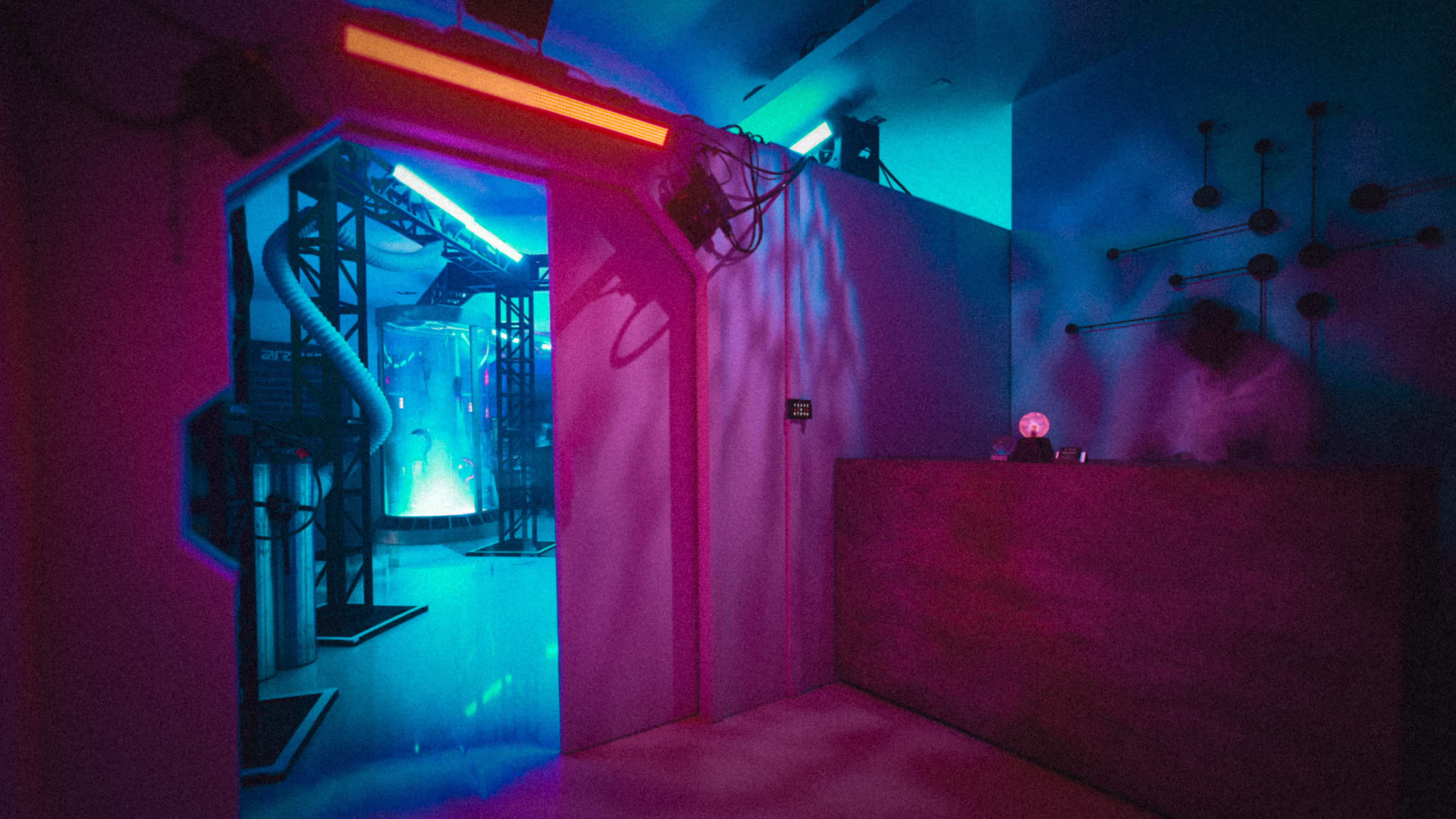 alien halloween party hallway with pink and blue lighting