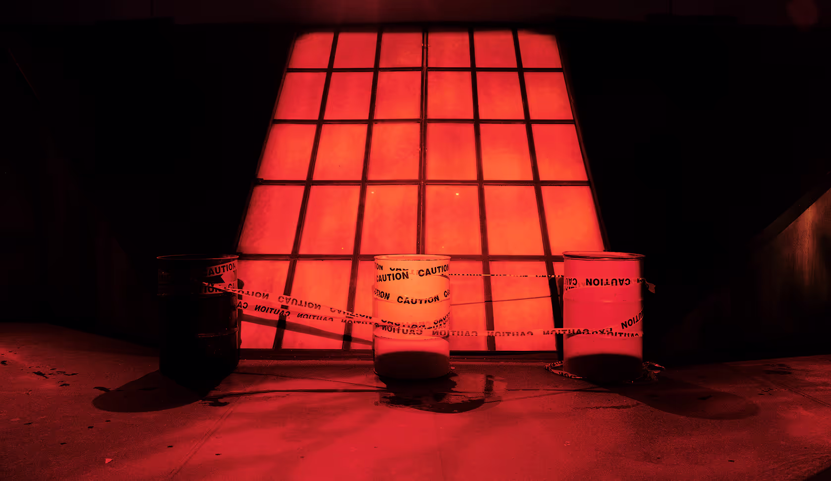A red light is shining on a wall.