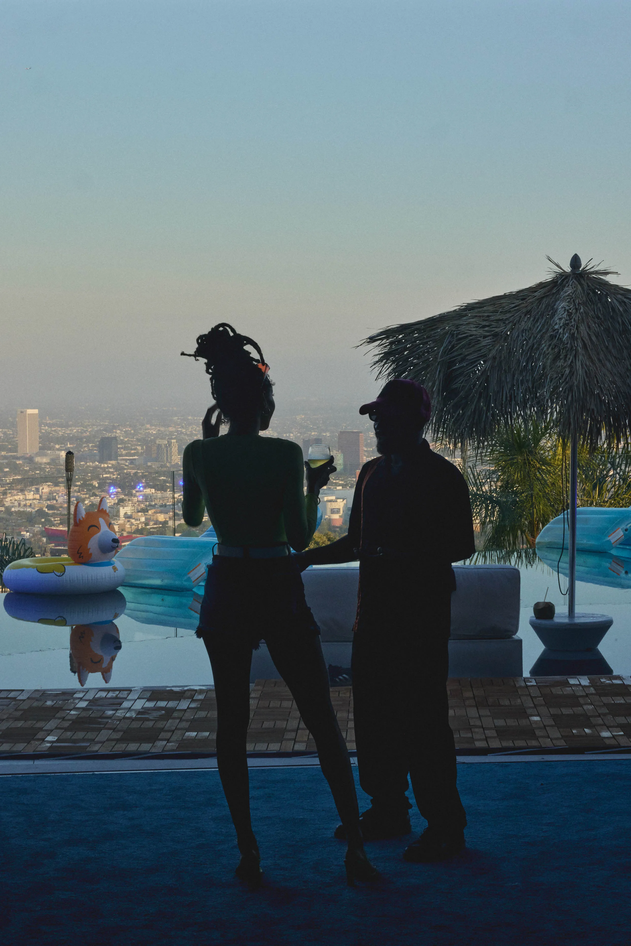 people standing beside an outdoor pool