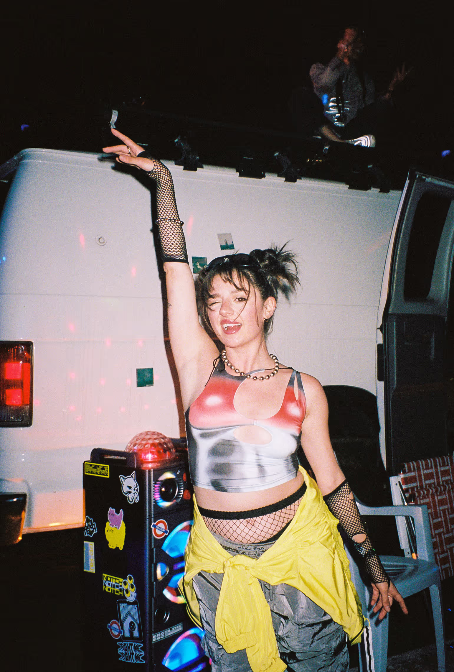 girl in front of white van with 90s raver outfit