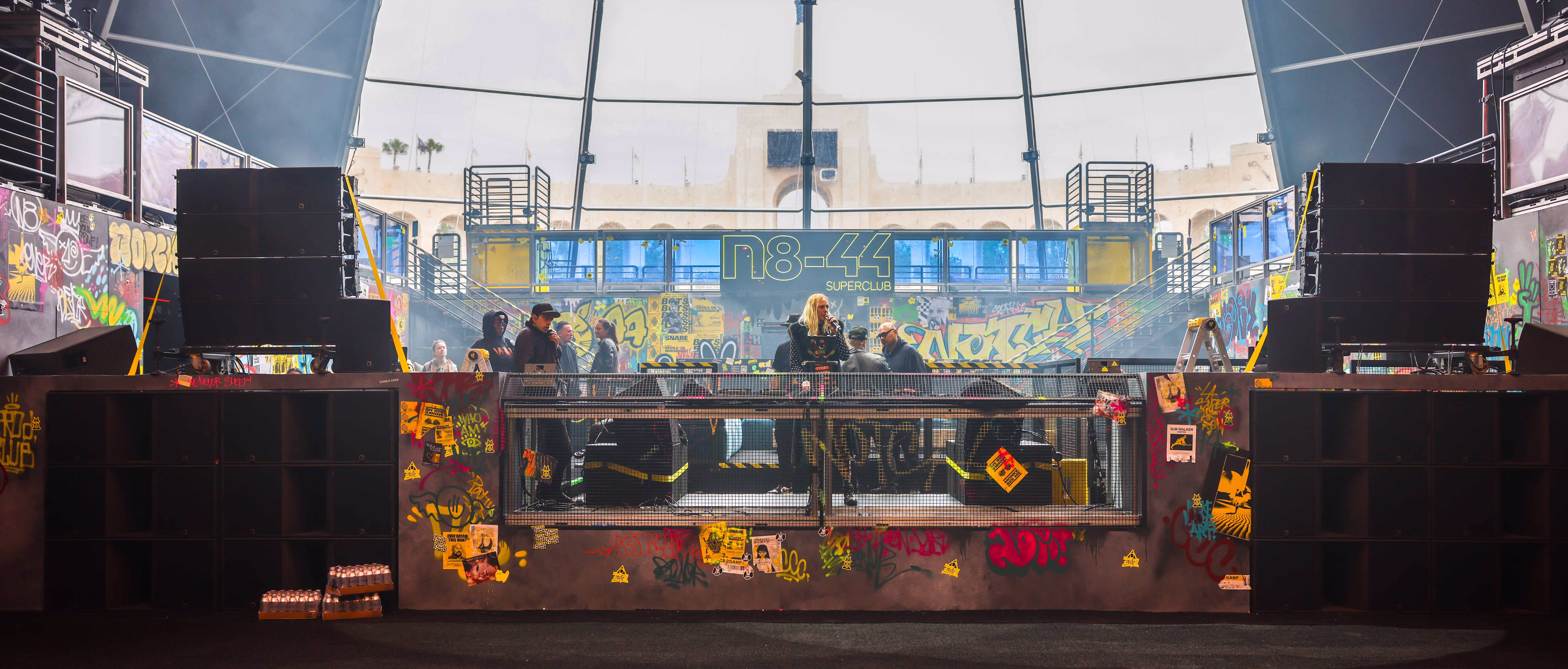 A group of people standing on top of a stage.