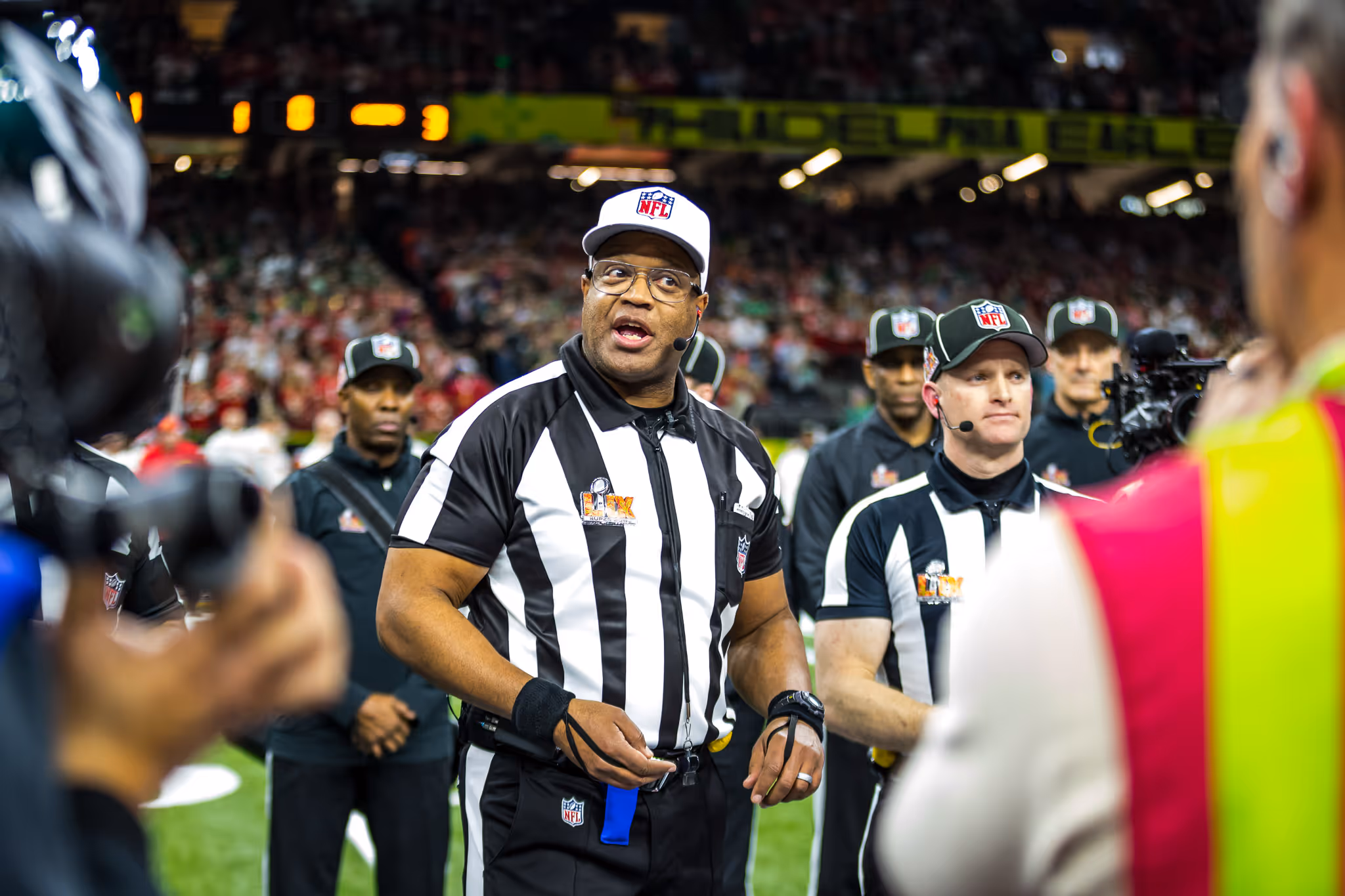 Referee standing in front of a group