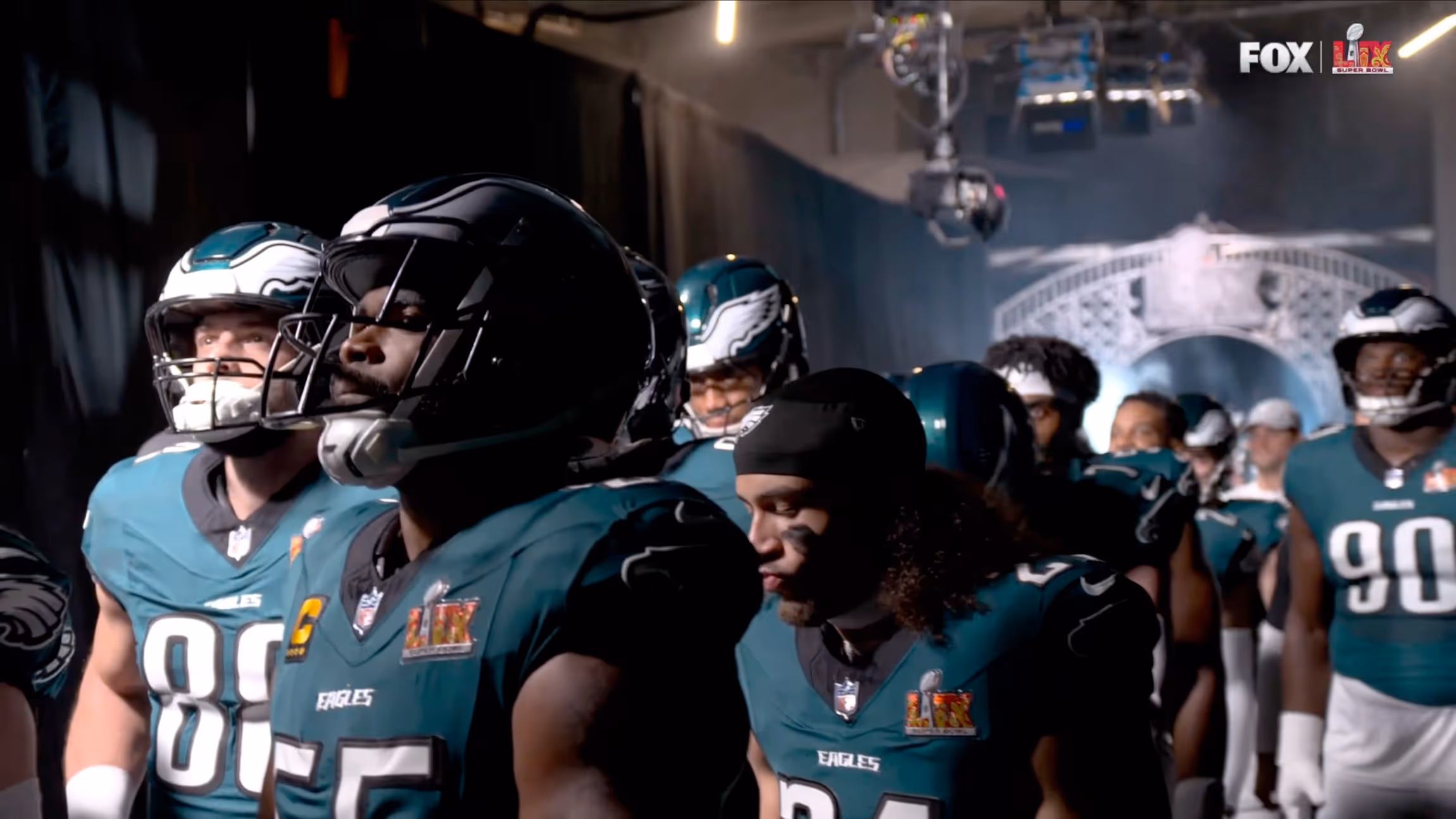Football players standing next to each other