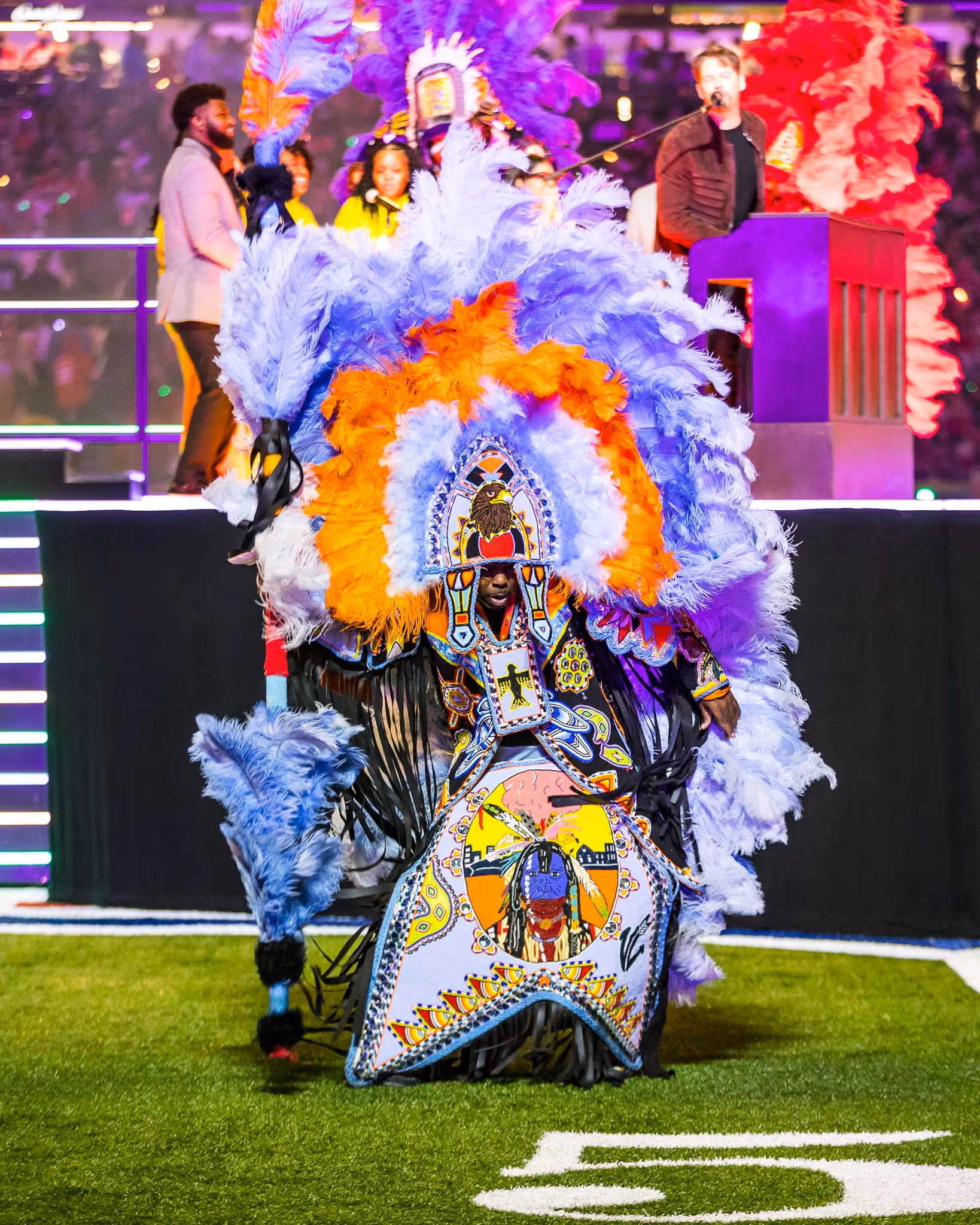 Person in colorful costume on field