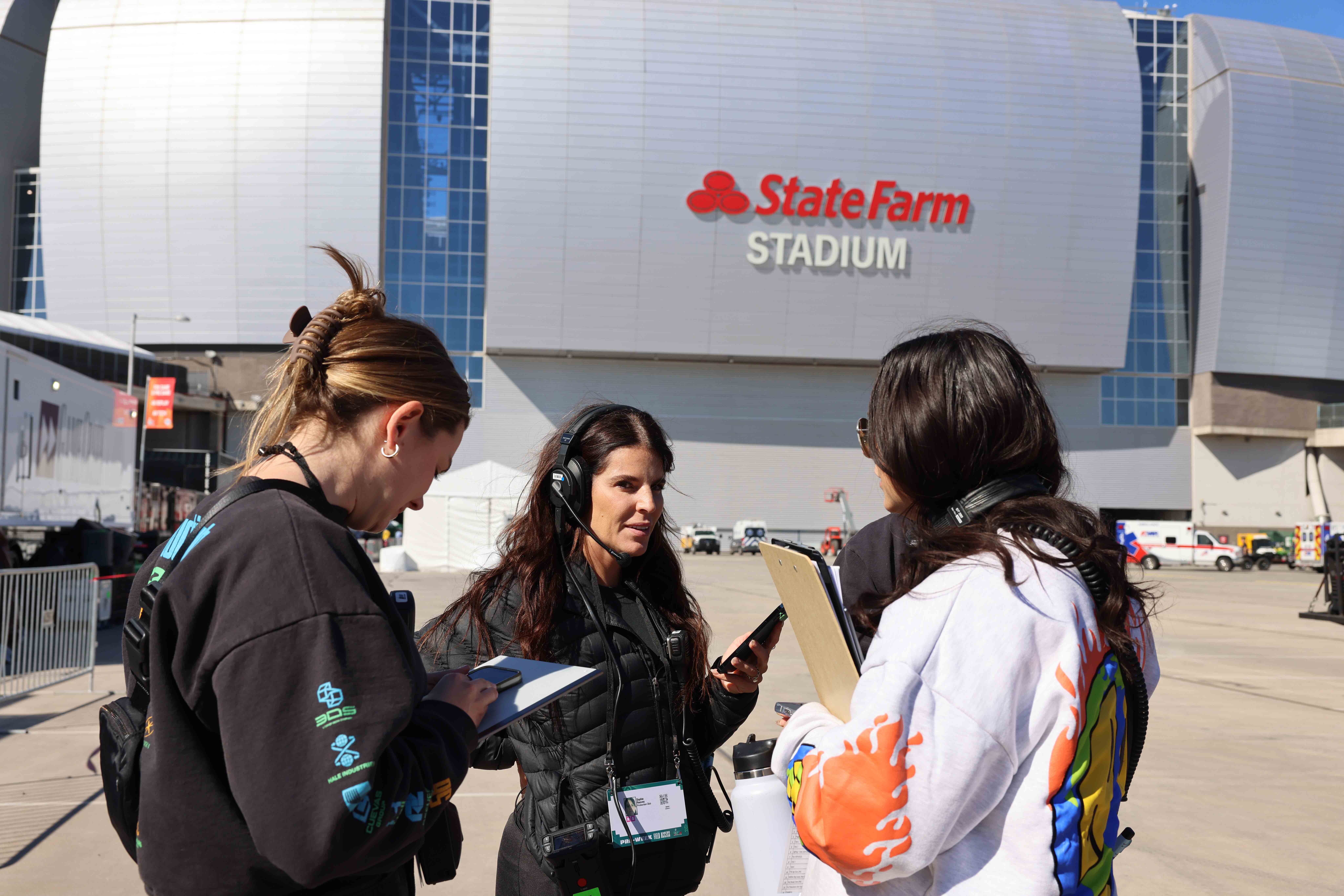 a group of women standing outside a building