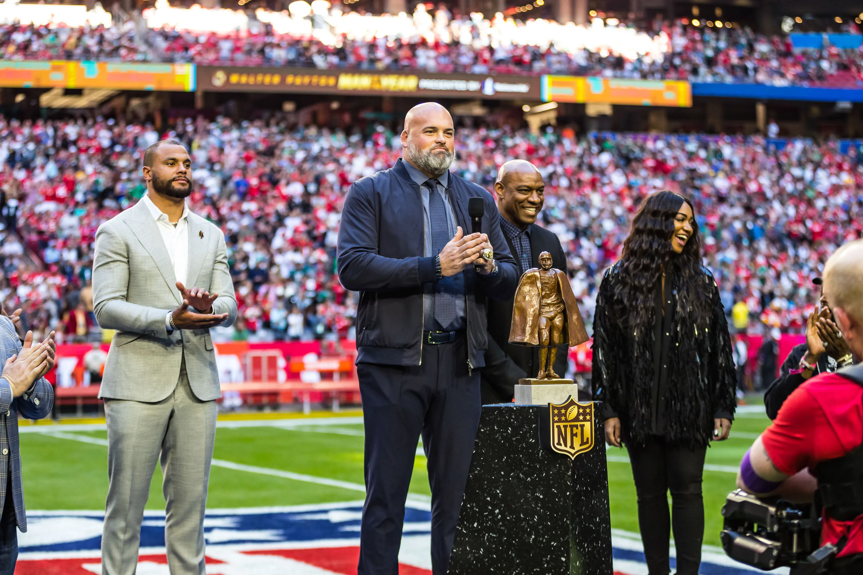 a person holding a trophy