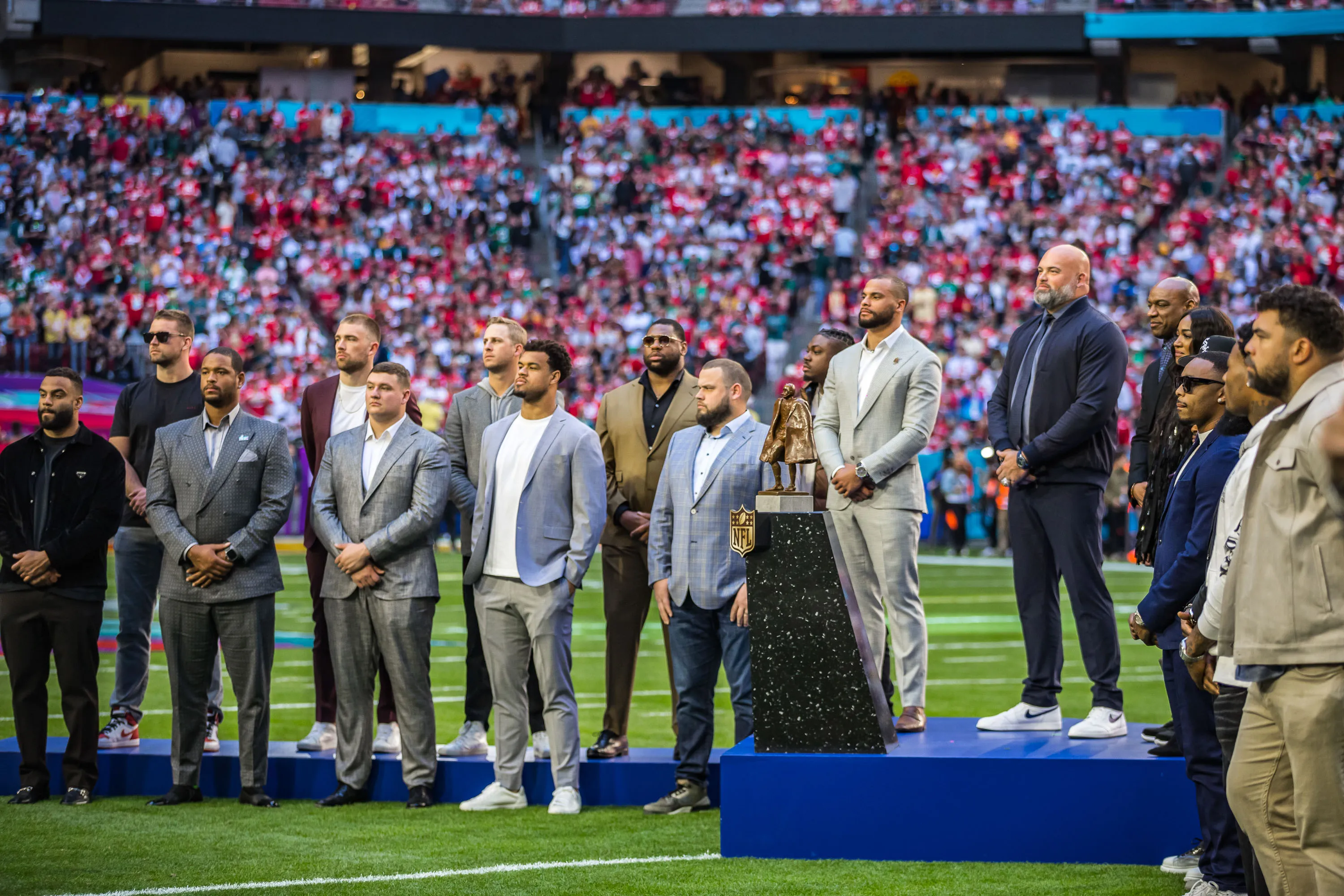 a group of people standing on a field