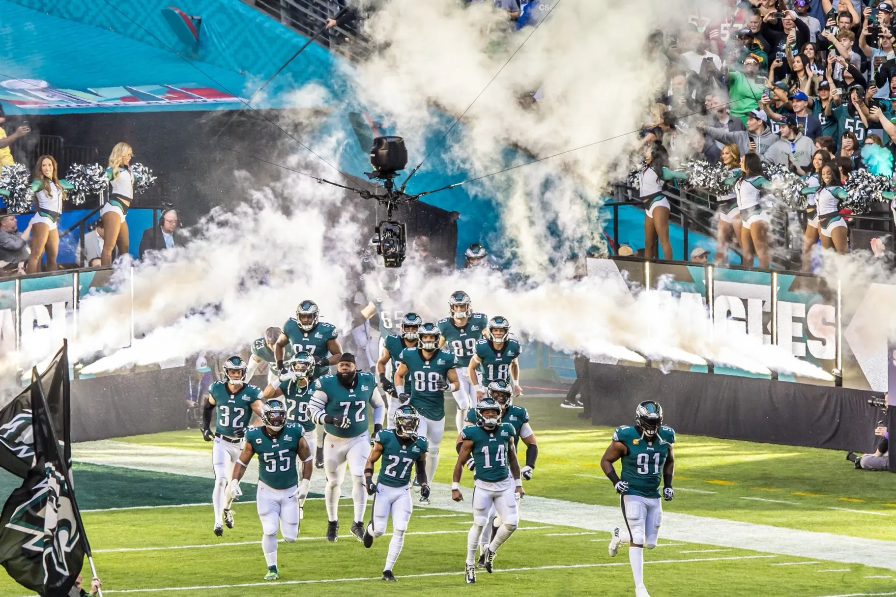 a football game with a crowd watching