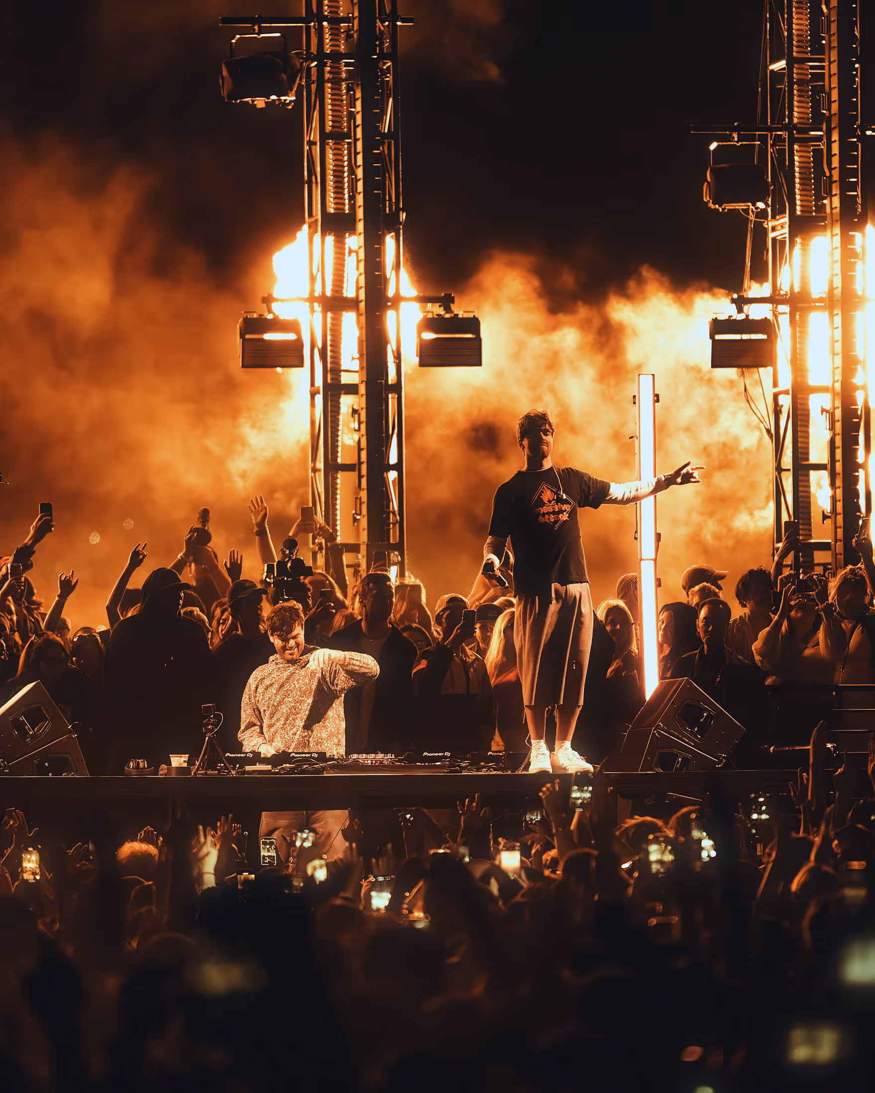 Man standing on stage in front of crowd
