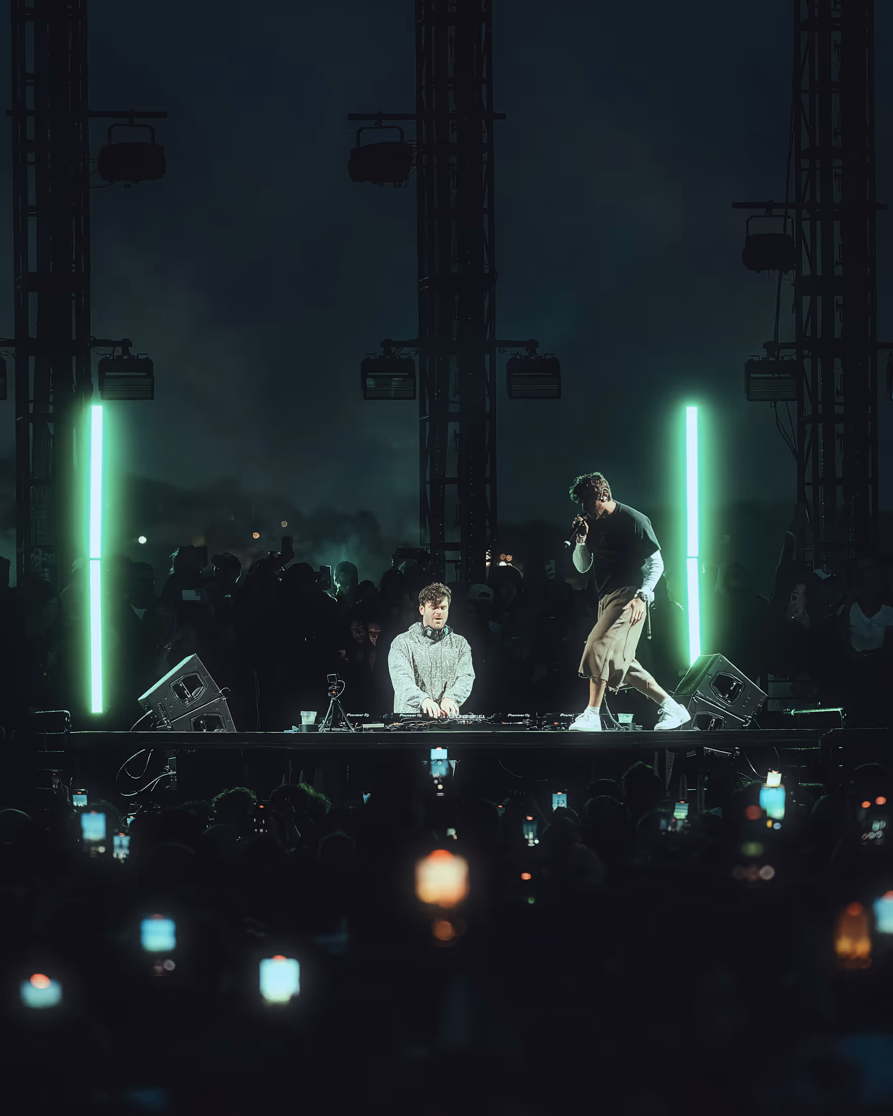 Man on stage next to another man