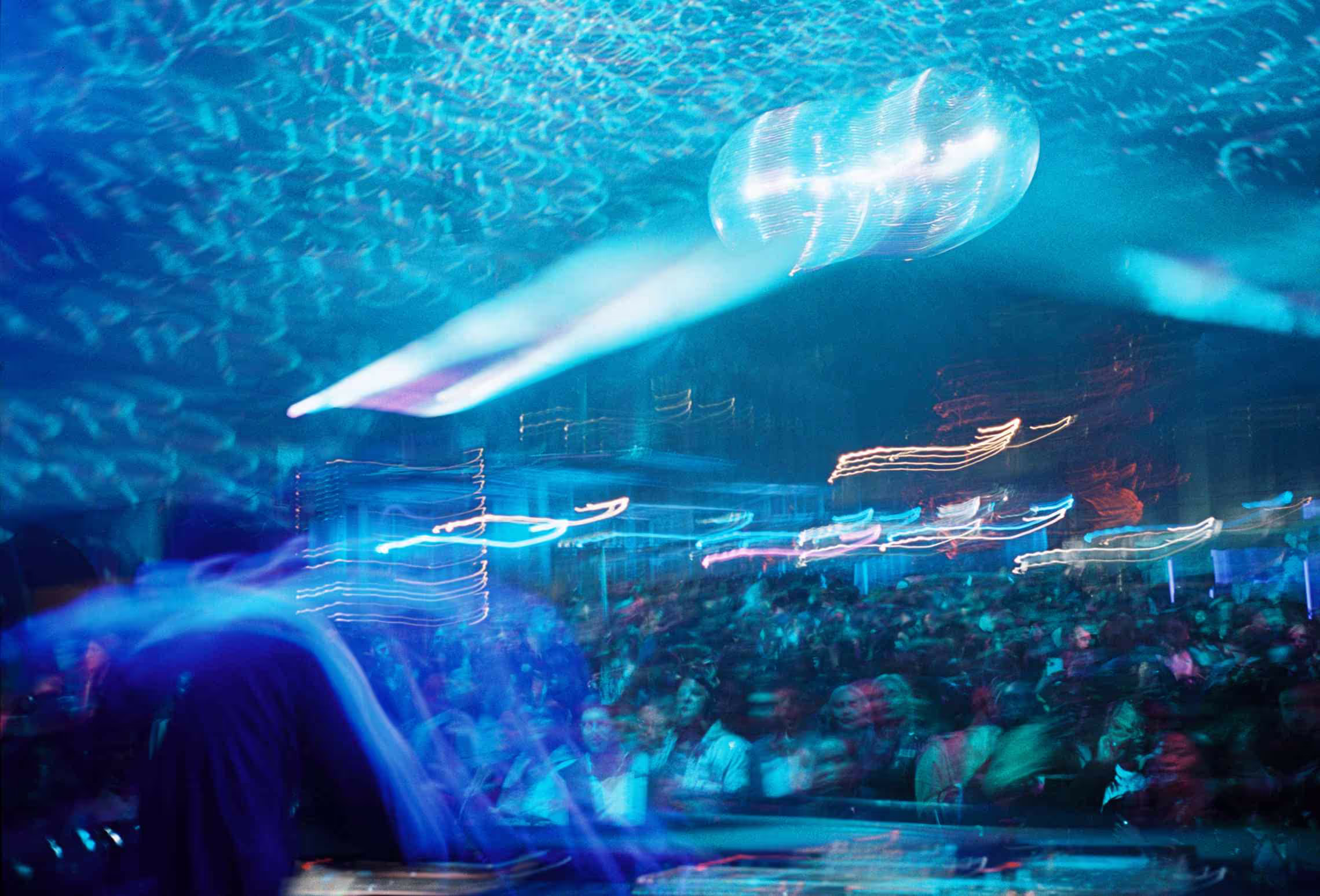 A blurry photo of a crowd at a concert.