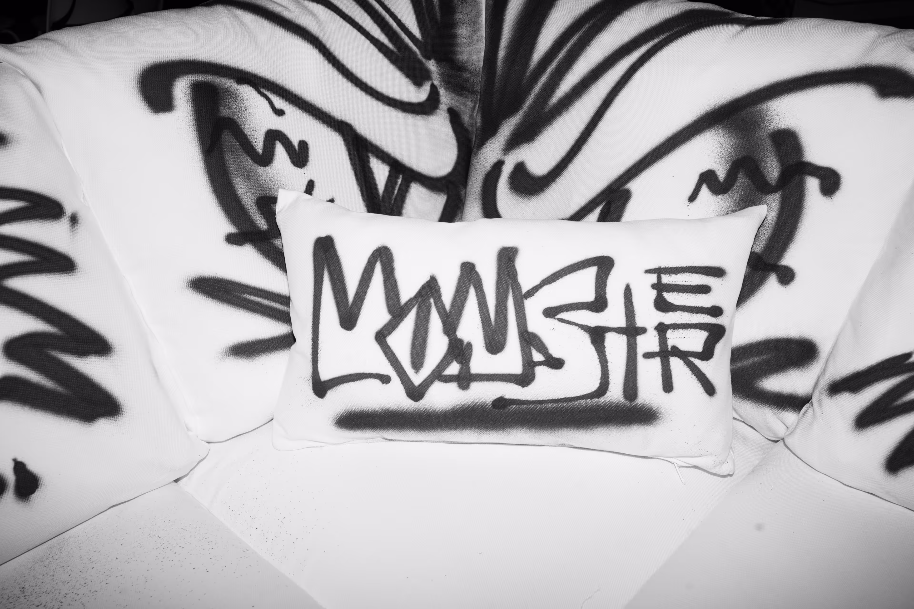 A pillow that has some writing on it.