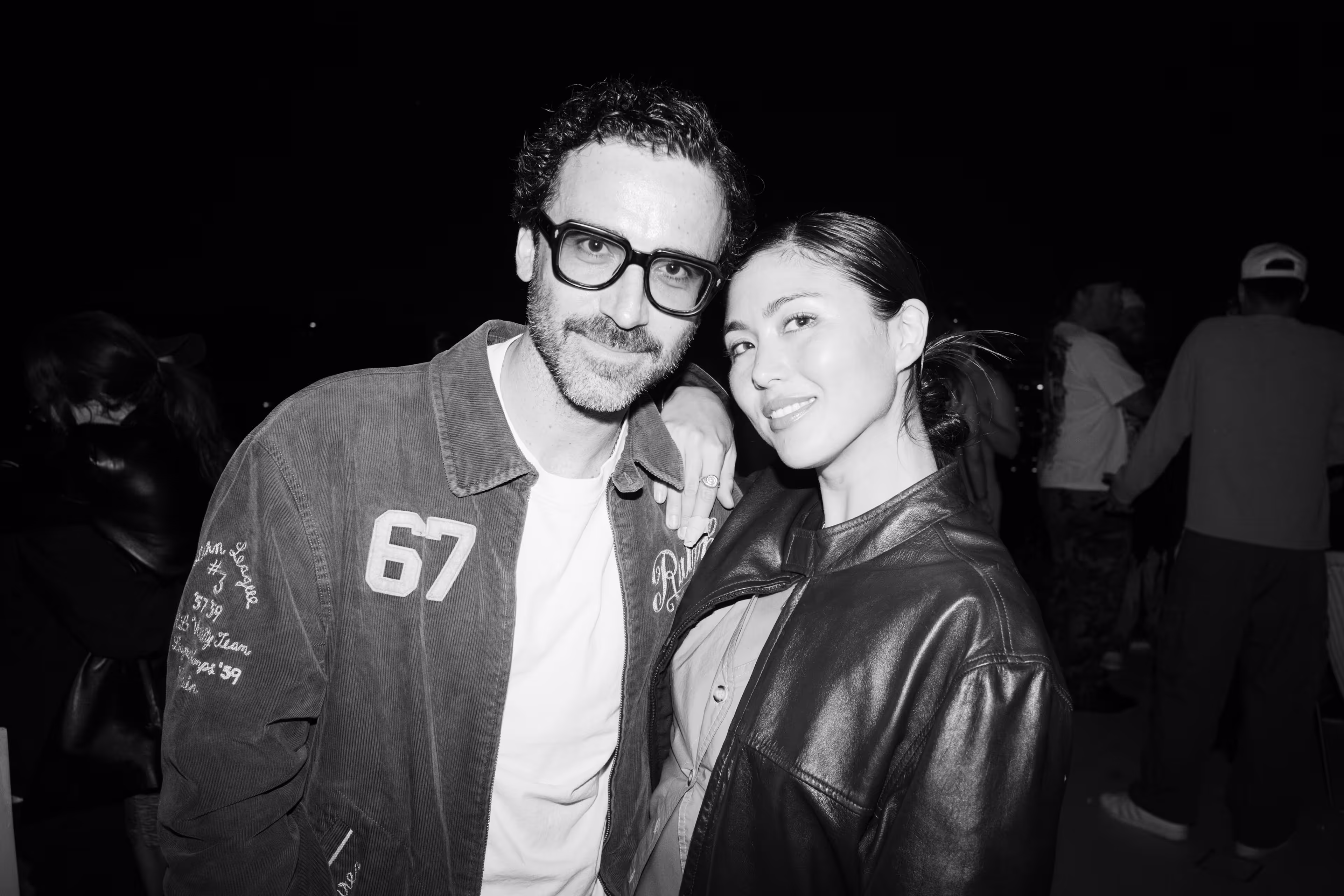 A man and a woman standing next to each other.