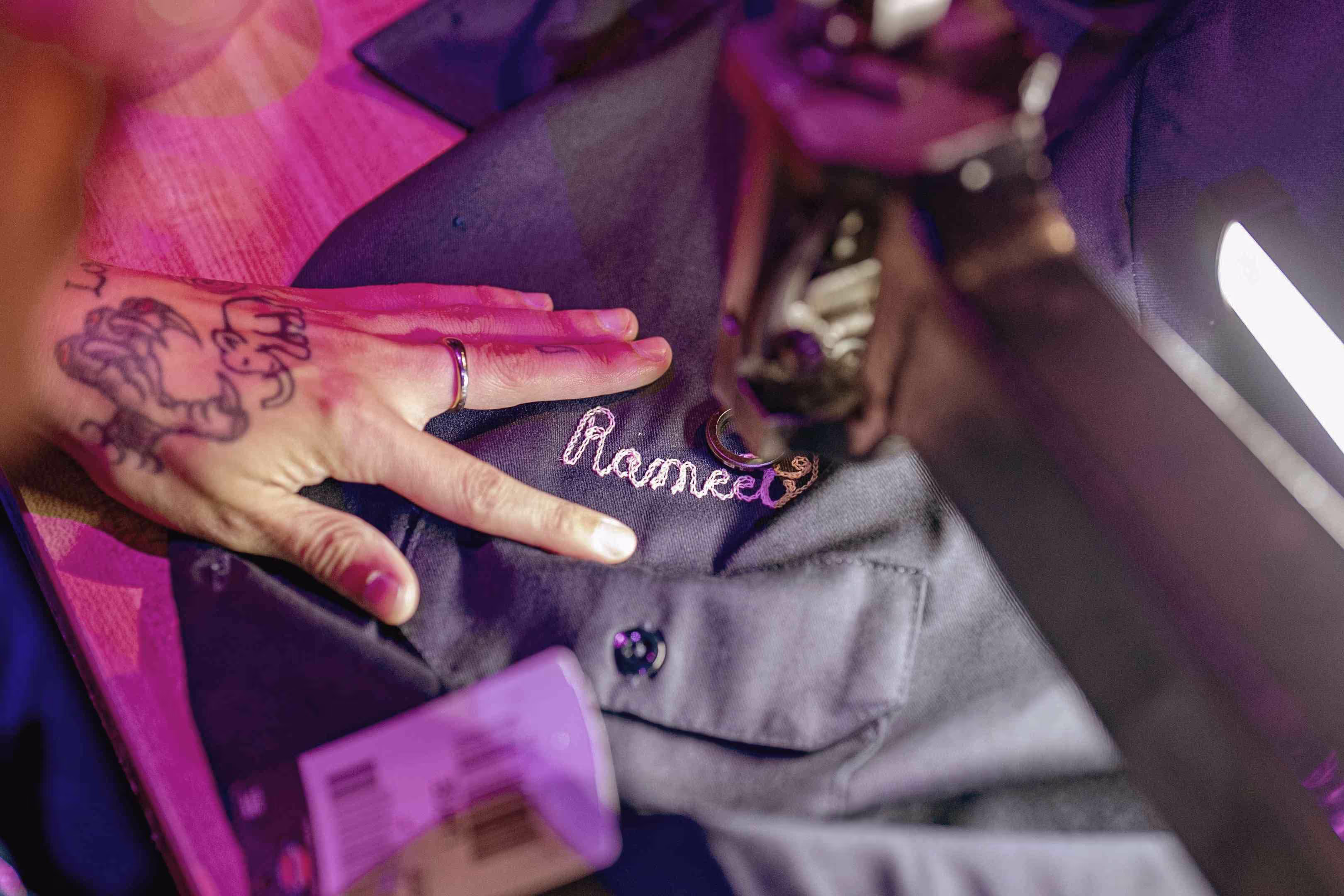 A person's hand with a name tattooed on it.