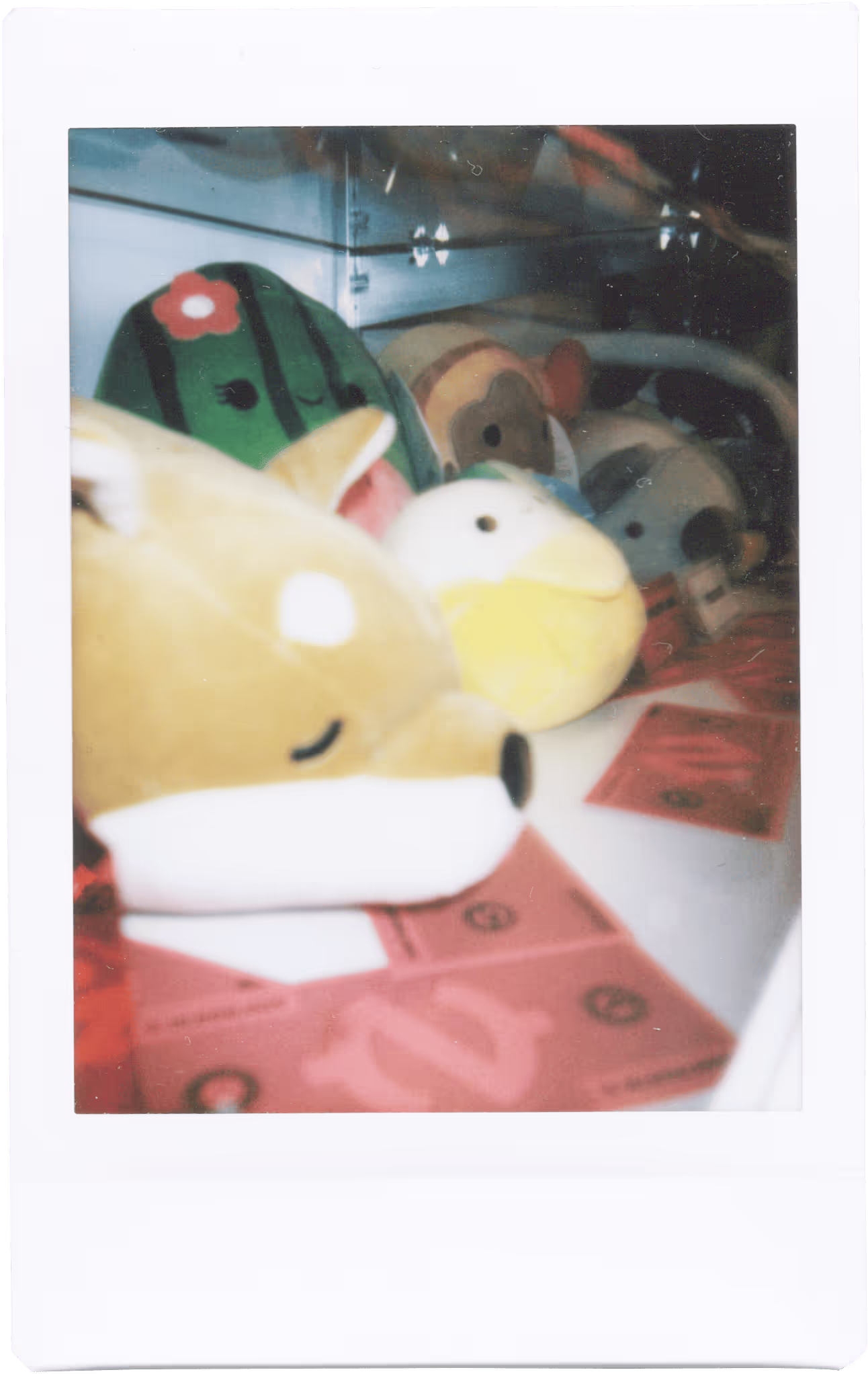 A group of stuffed animals sitting on top of a table.