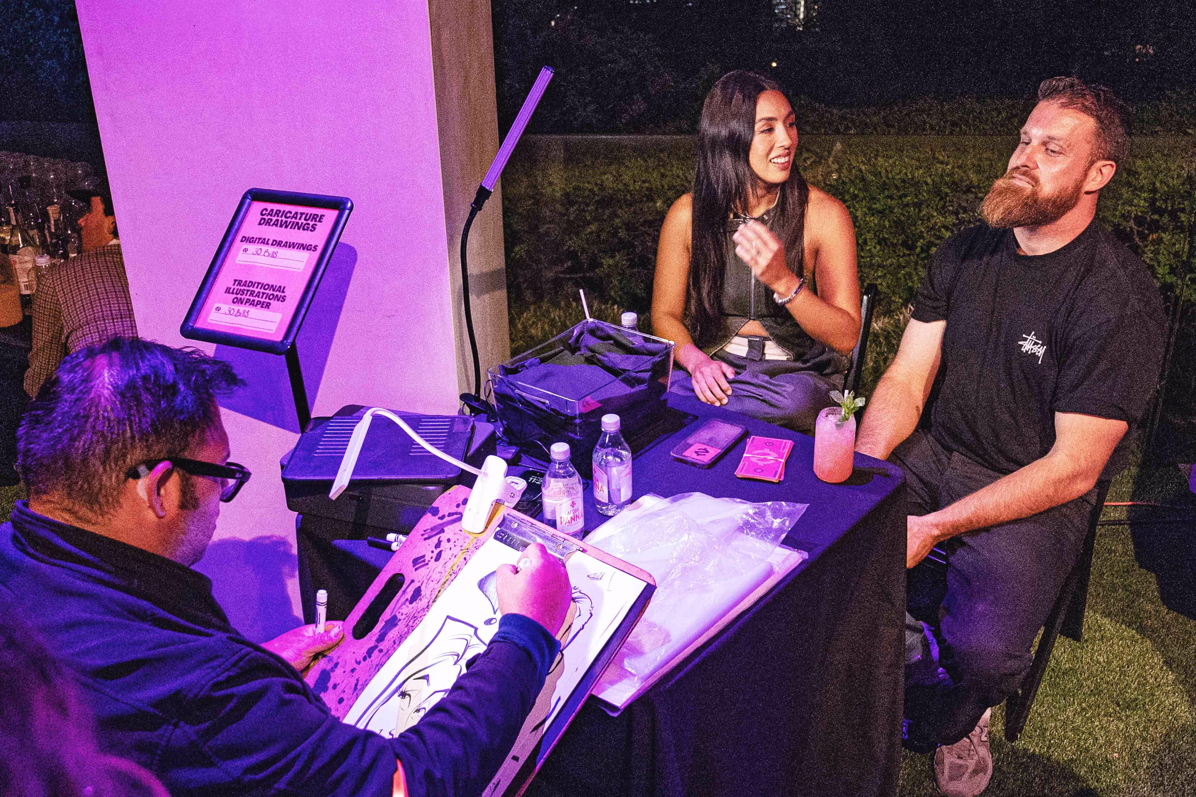 A group of people sitting around a table.