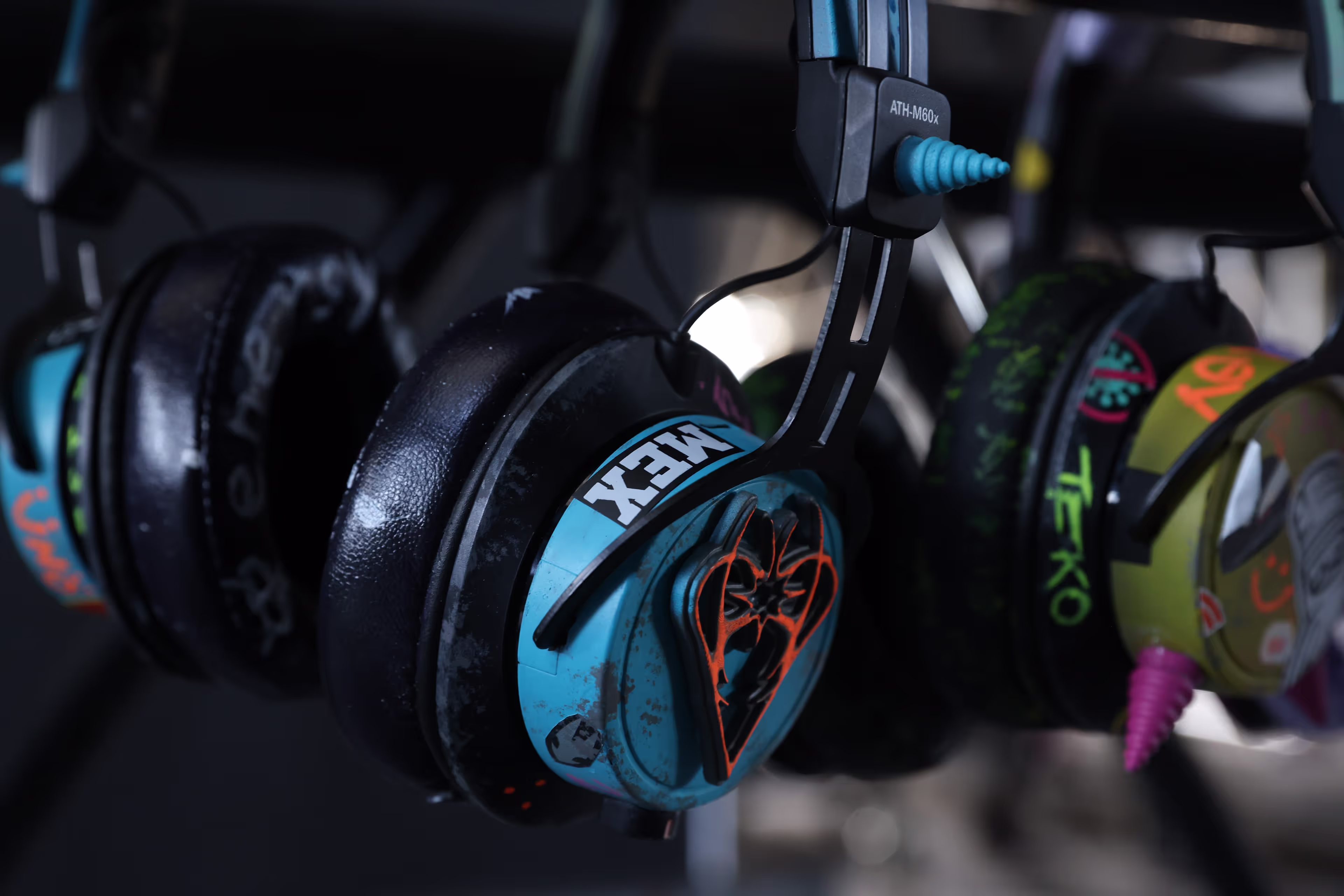 A rack with headphones hanging from it.