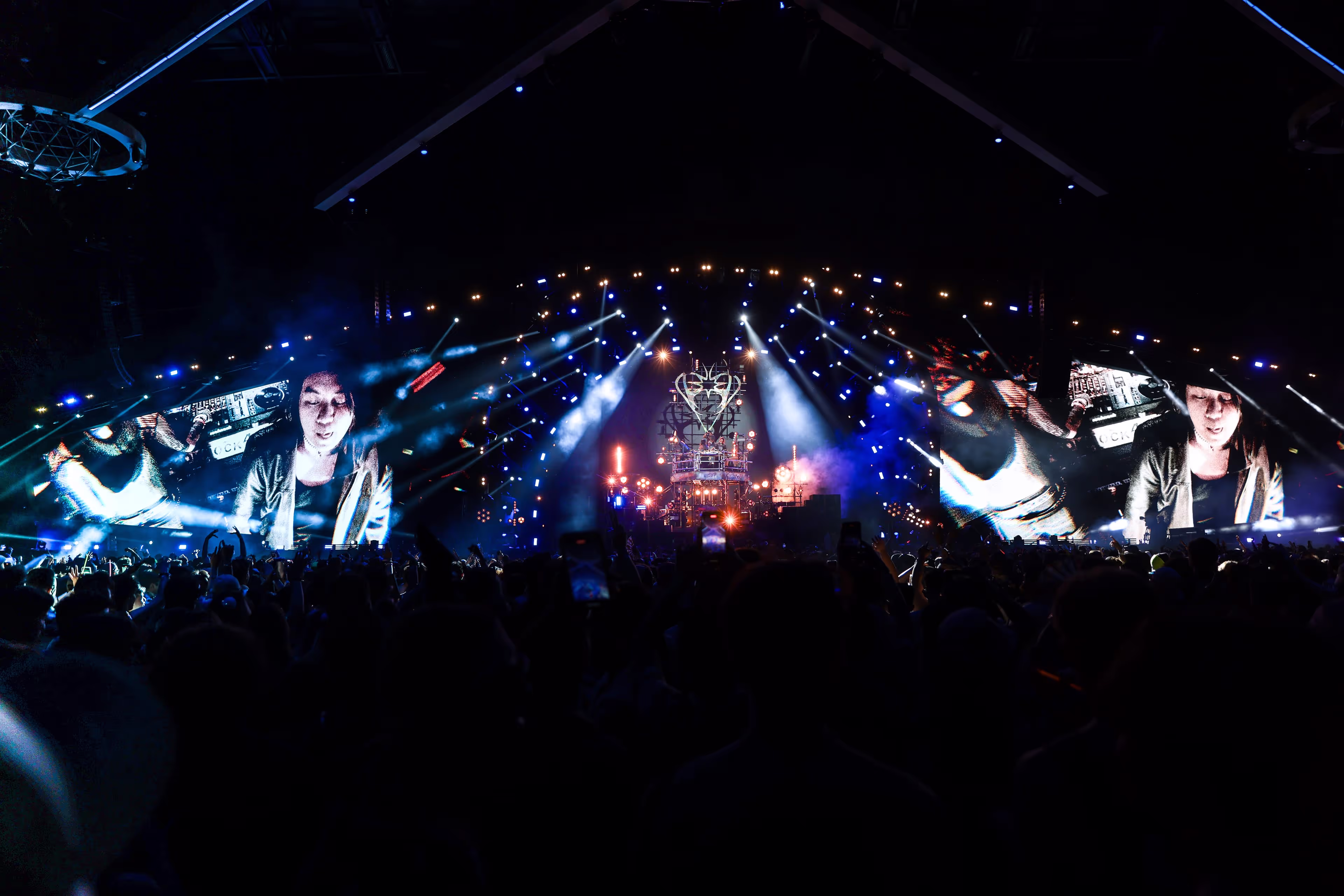 A crowd of people standing on top of a stage.