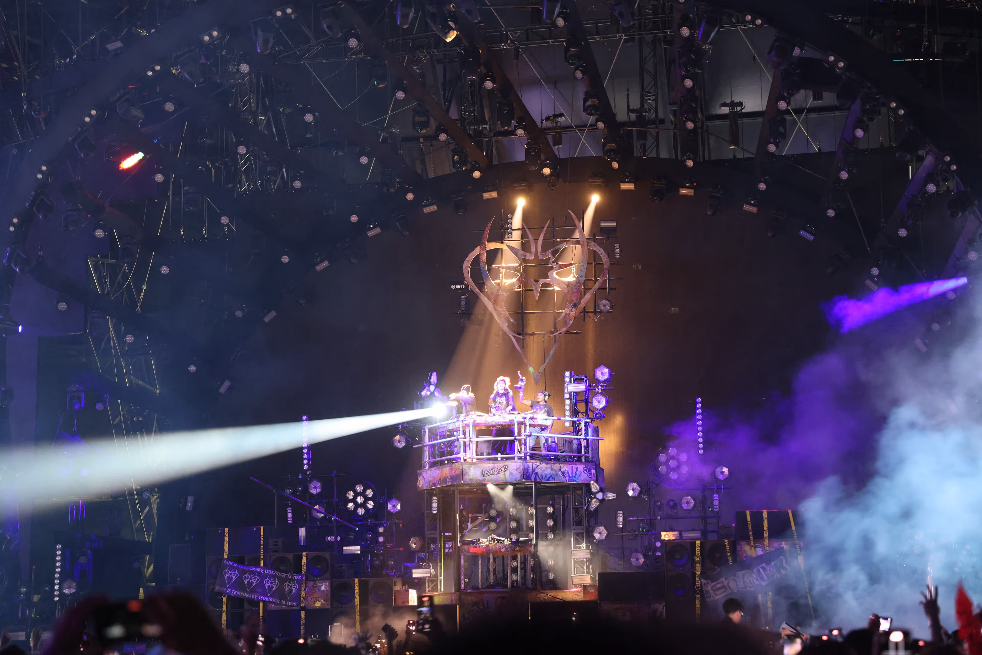 A stage with a lot of lights and smoke.