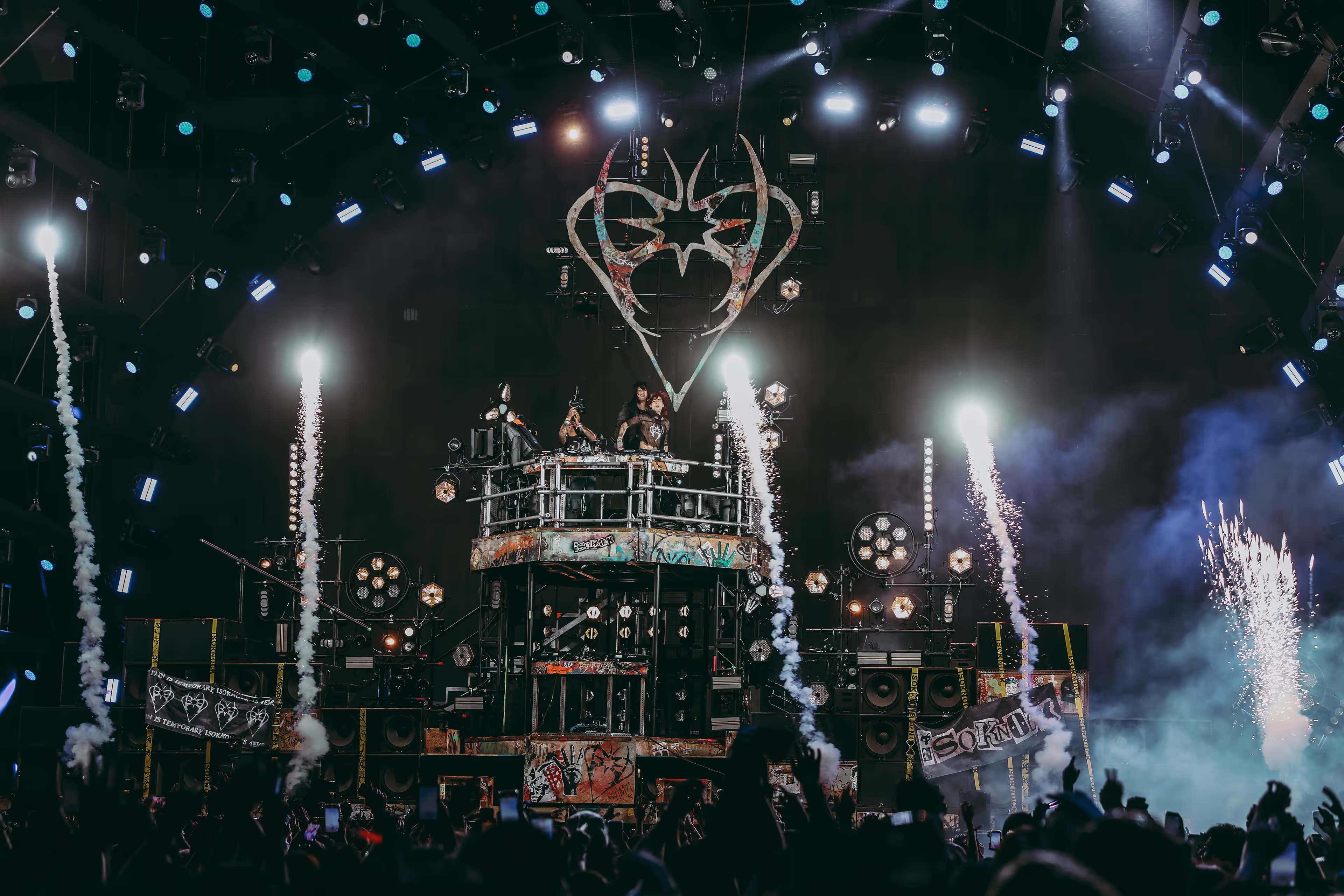 A crowd of people standing on top of a stage.