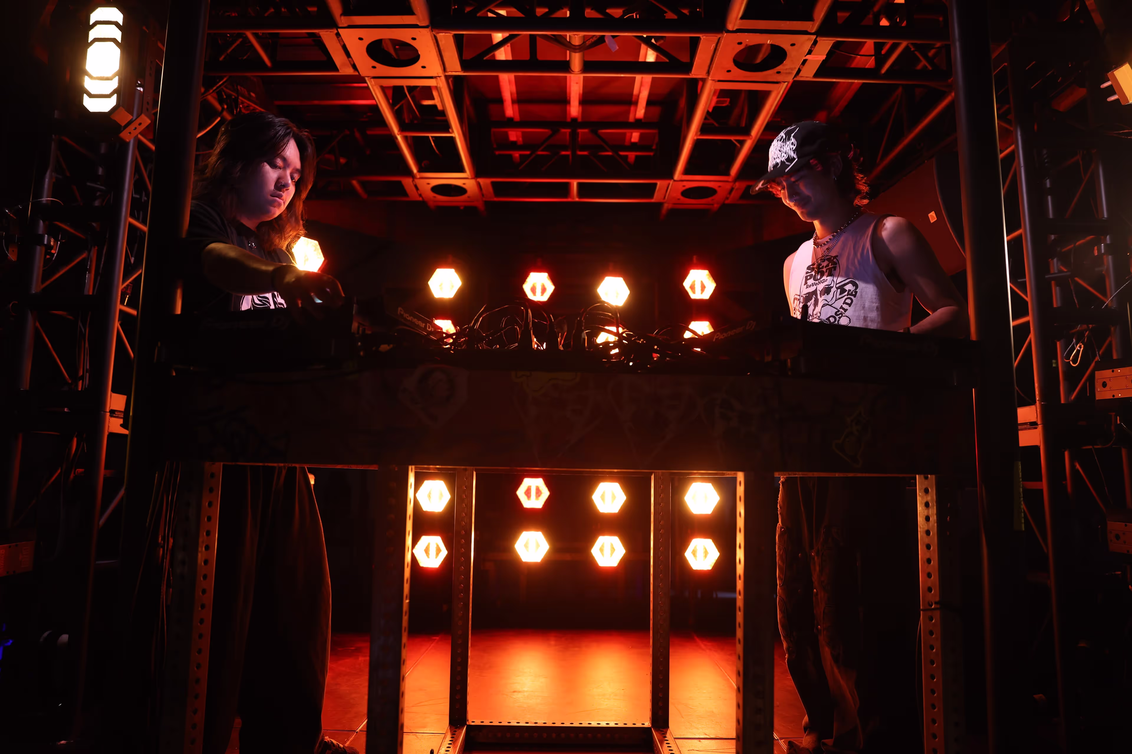 A couple of people standing on top of a stage.